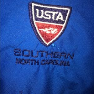 USTA jacket with removable sleeves .